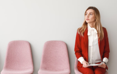 Young Woman Waiting For Job Interview Indoors