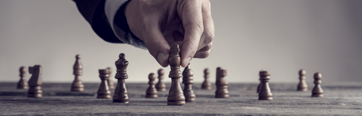 Wide Cropped Image Of A Human Hand Wearing Business Suit Moving Dark King Chess Piece