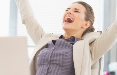 Portrait Of Happy Business Woman In Office Rejoicing Success