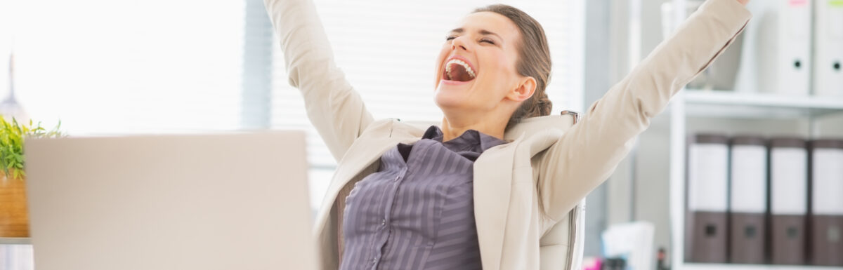 Portrait Of Happy Business Woman In Office Rejoicing Success